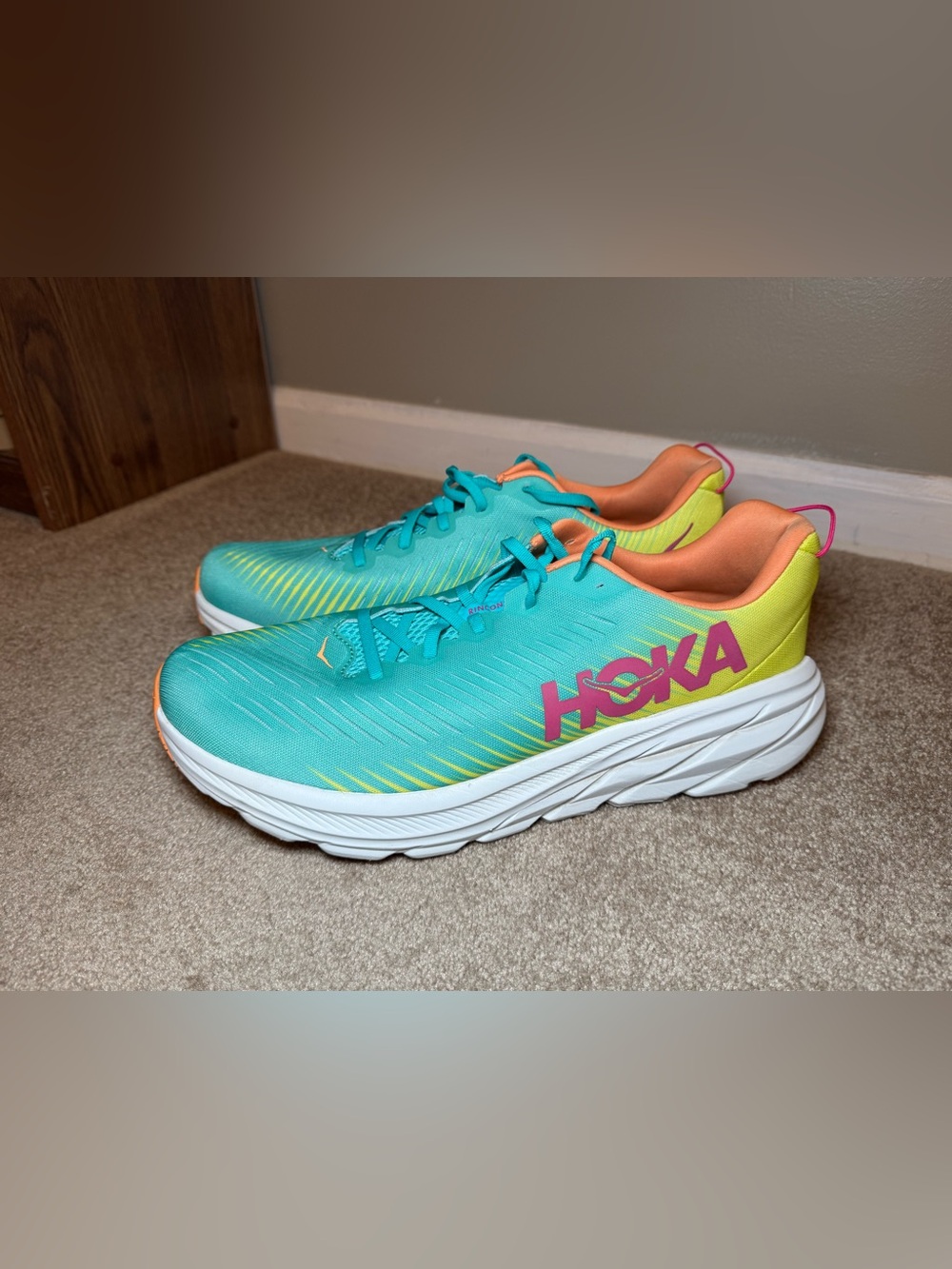 Hoka Teal Running Shoes with Pink and Yellow Accents